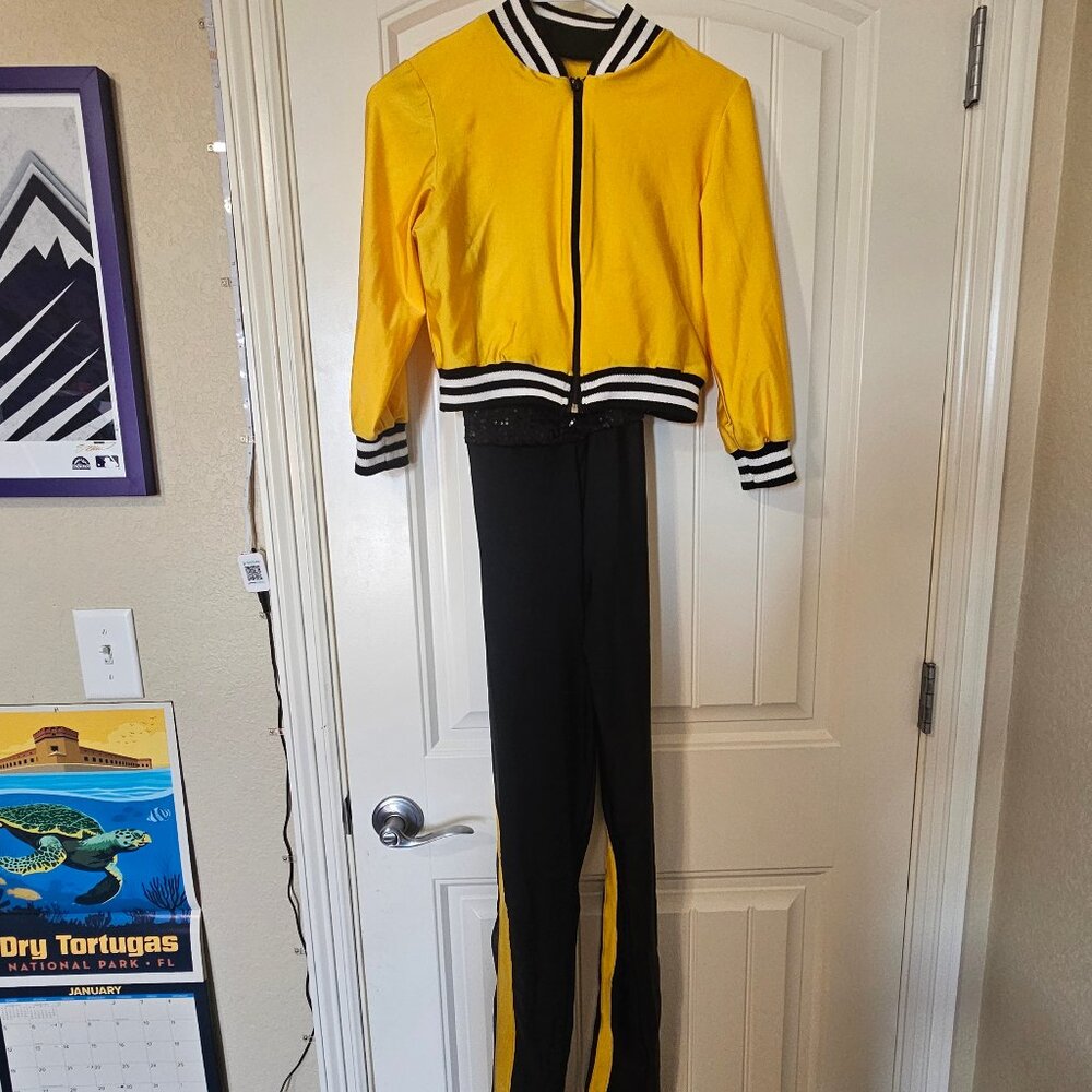 Yellow jacket with black one piece dance costume